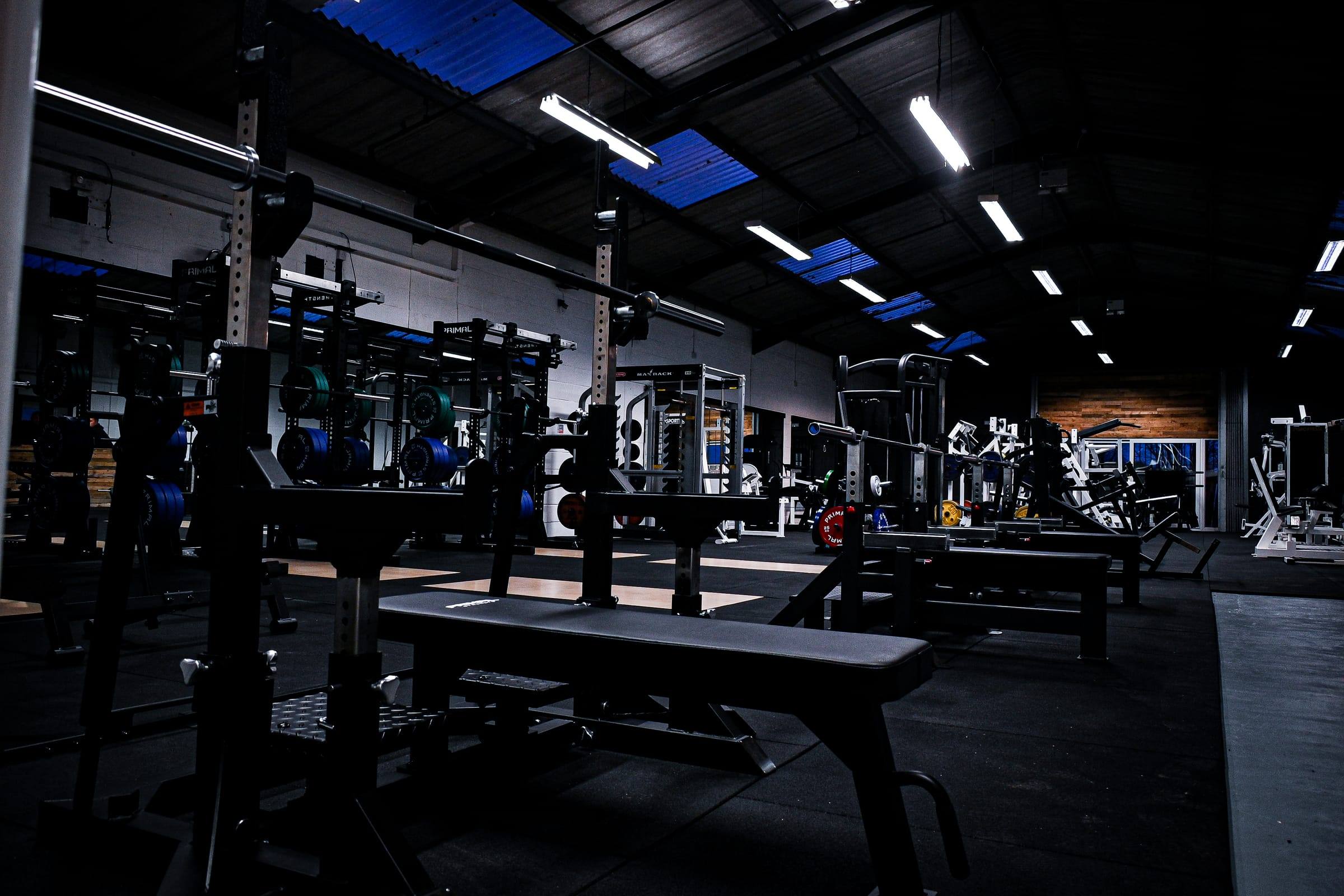 Squat racks and flat benches running down the Yeovil gym